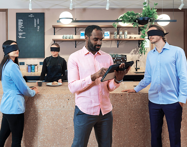 Blindfolded onlookers illustrates the power of a Kensington professional privacy screen to shield a  tablet from prying eyes.