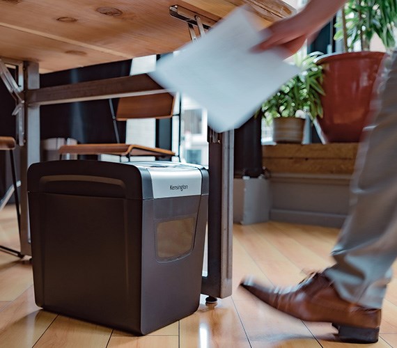 Person using a Kensington shredder.